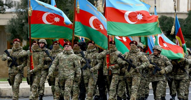 media-the_battle_flags_of_the_military_units_that_took_part_in_the_war_passed_in_front_of_the_rostrum_under_the_leadership_of_major_general_zaur_mammadov
